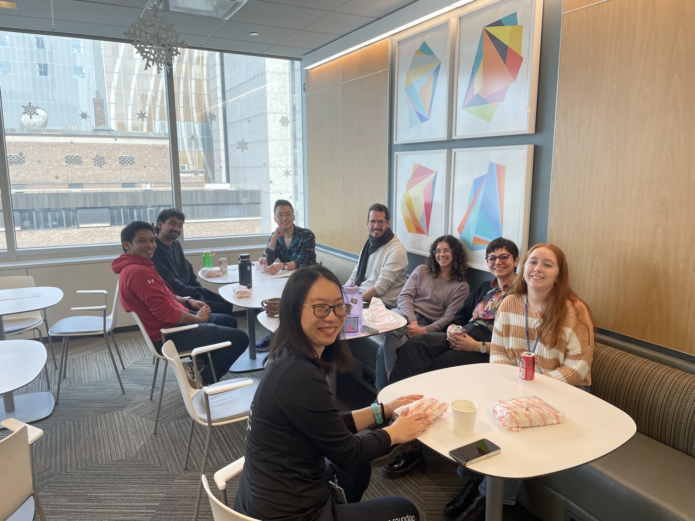 The lab having lunch together in the break room.