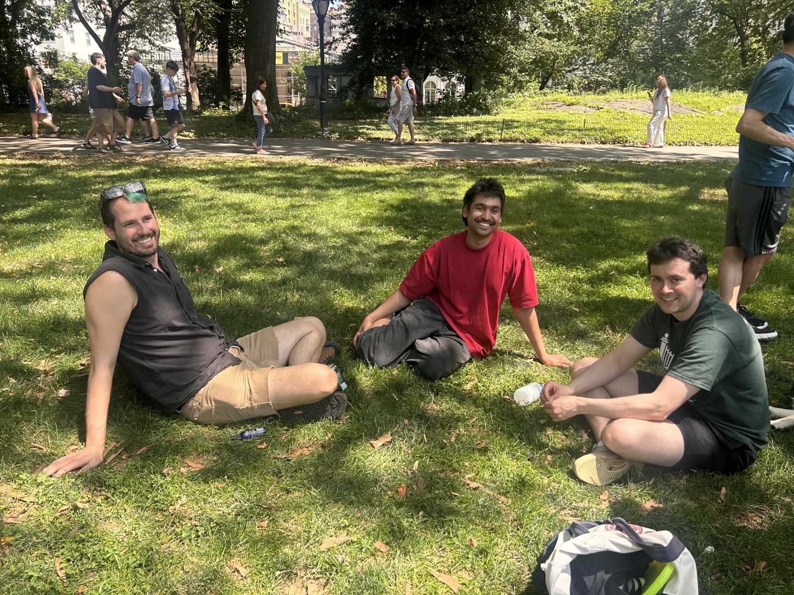 Three lab members relaxing on the lawn