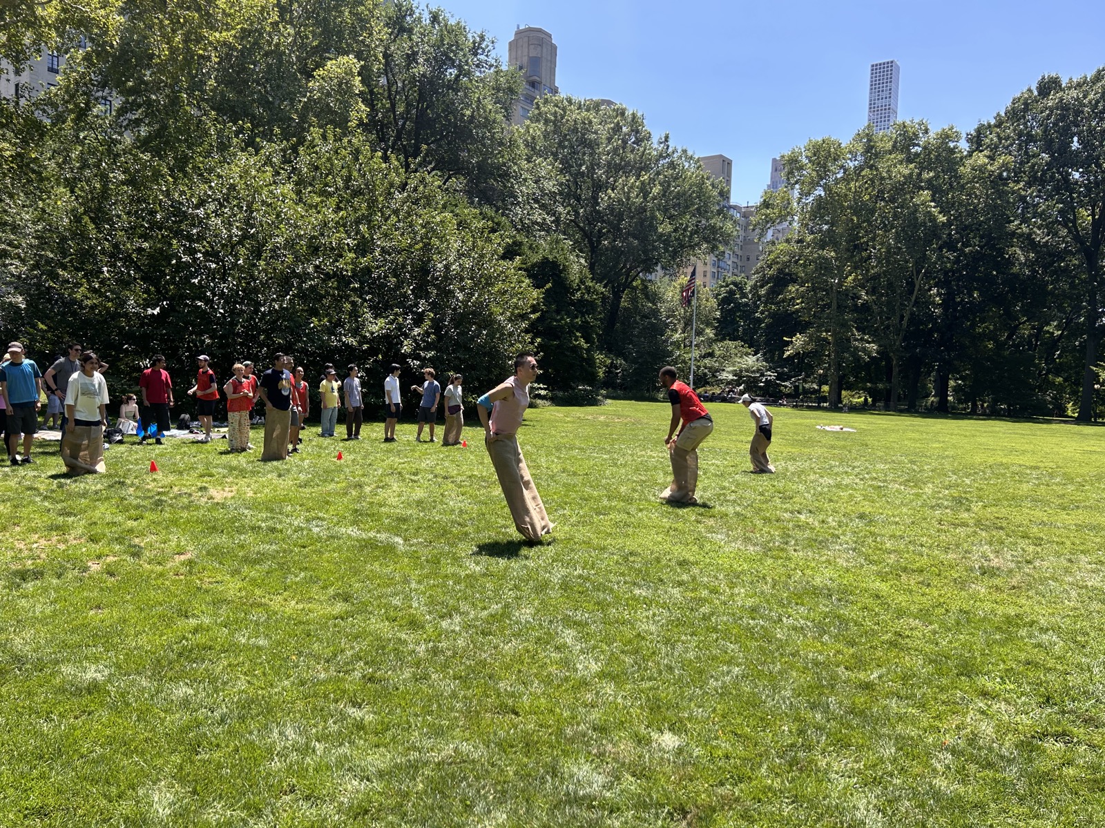 A sack race on the lab's Olympic Day in the park