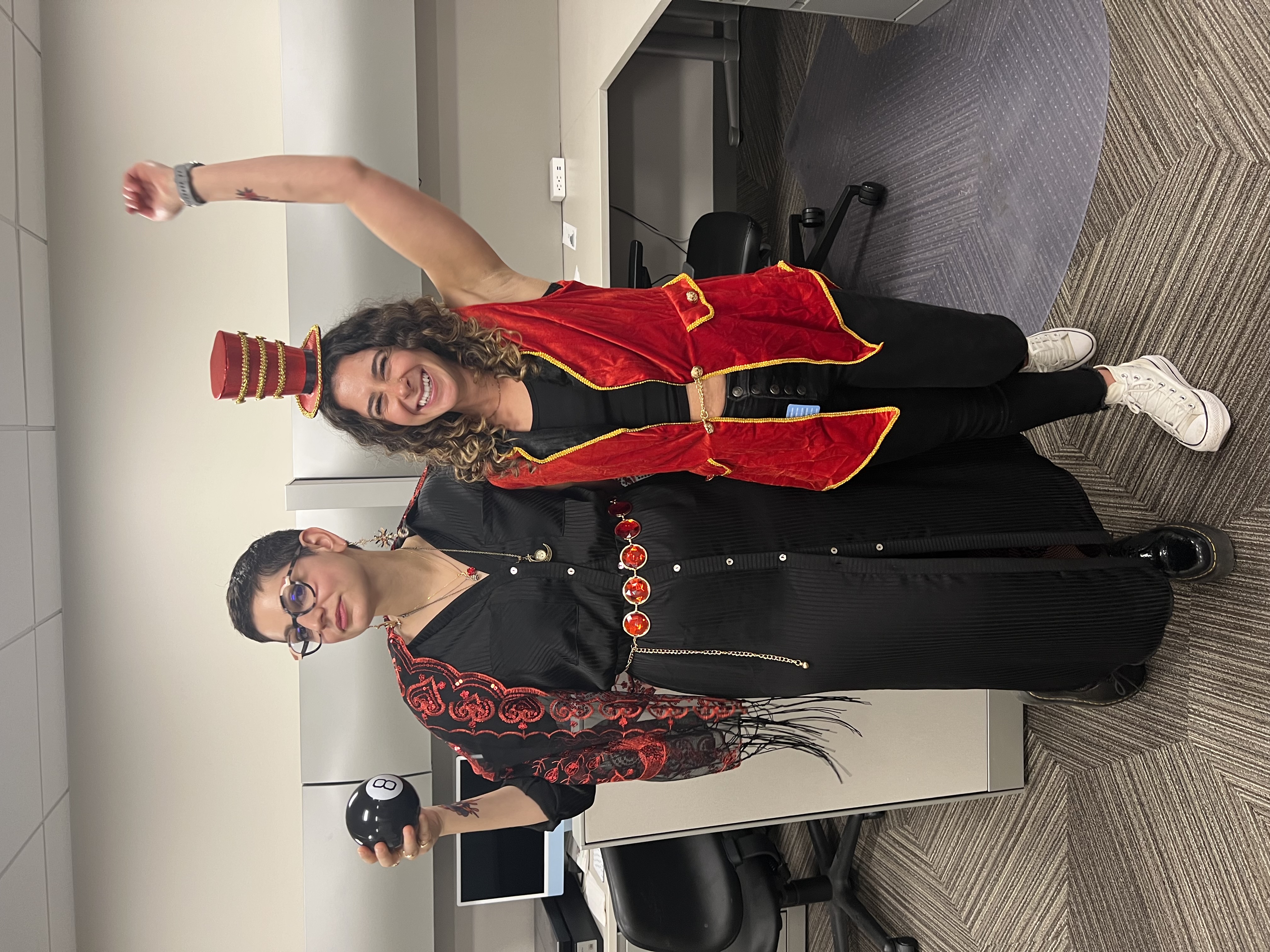 Two lab members in Halloween costumes in the office